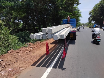 ﻿Vehicle booked for transporting power poles in violation at Sirlim