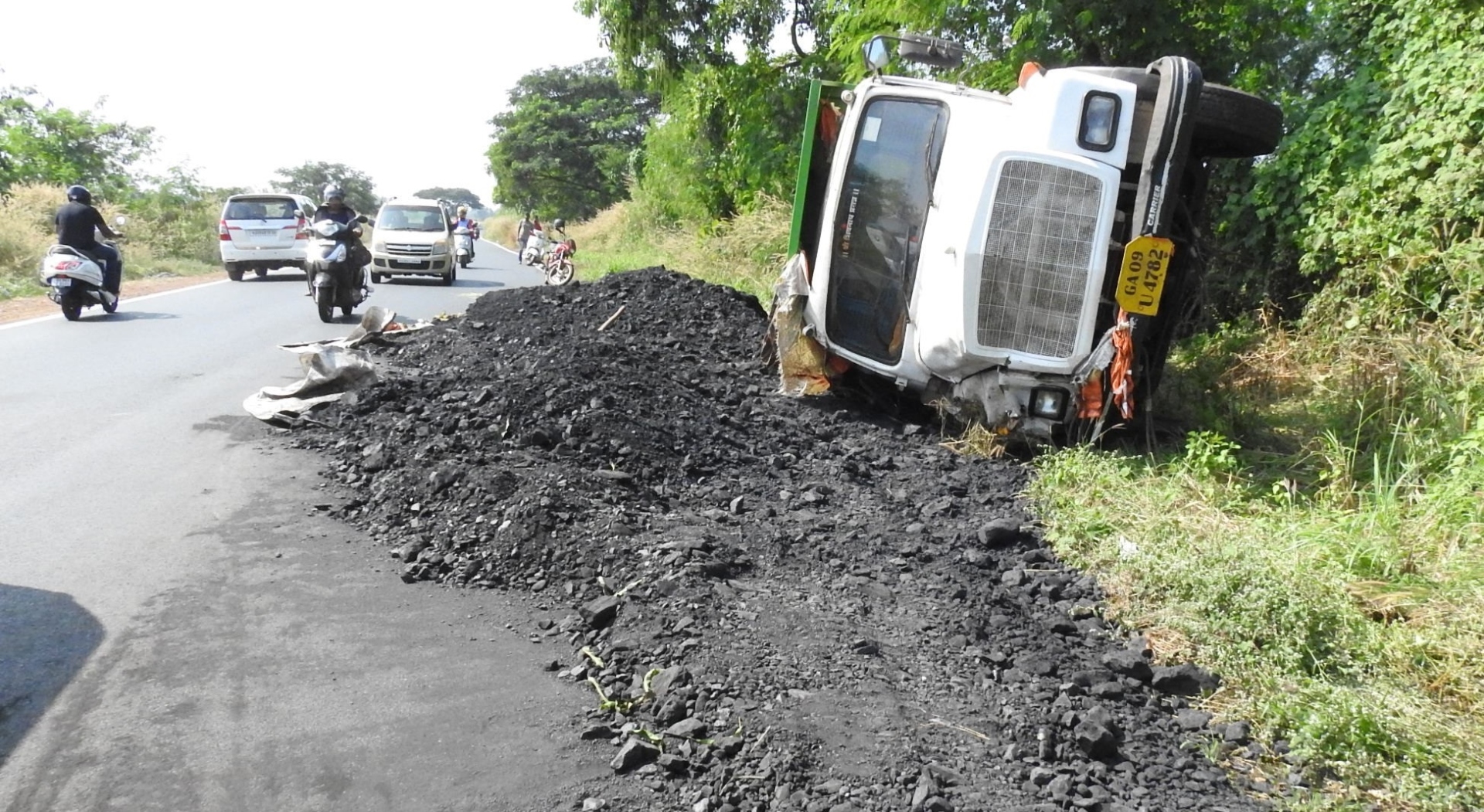 Coal spills on eastern bypass after truck falls on its side