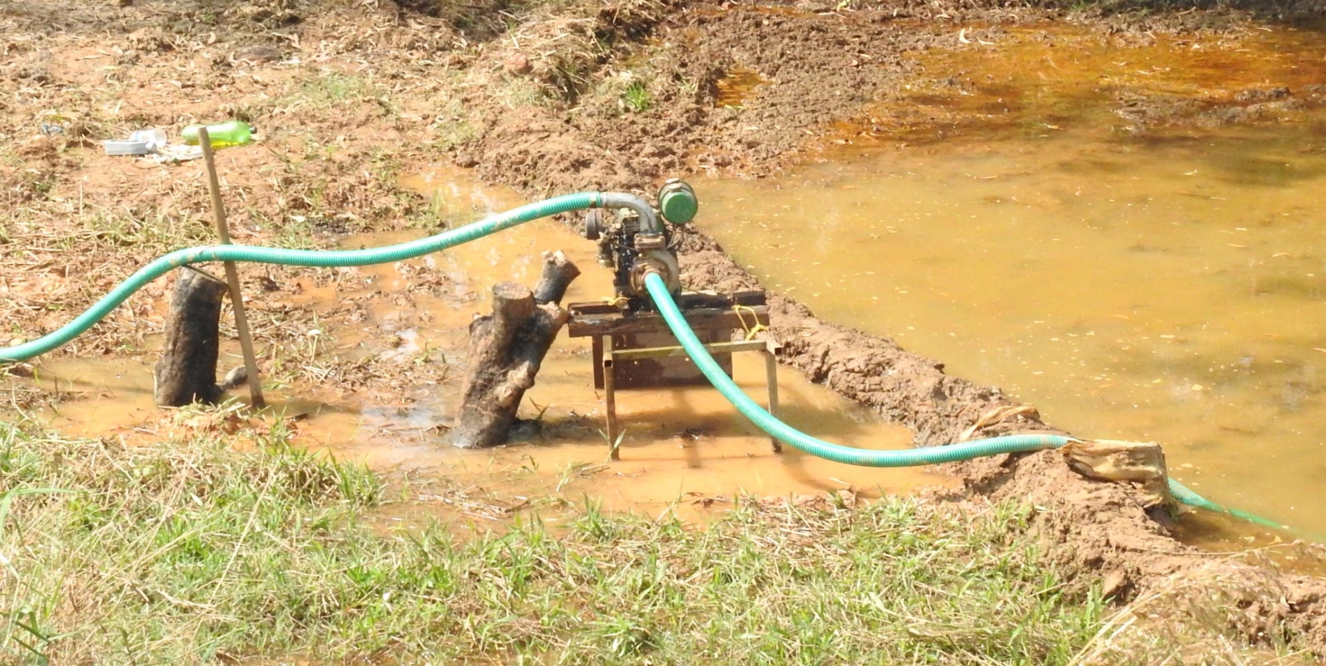 Farmers use pumps to drain out excess water from fields in Benaulim