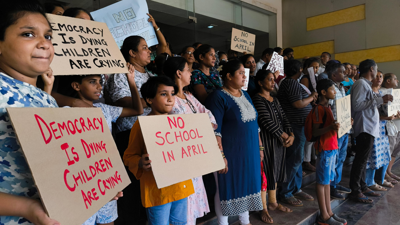 Schools reopen under new academic calendar, parents stage silent protest