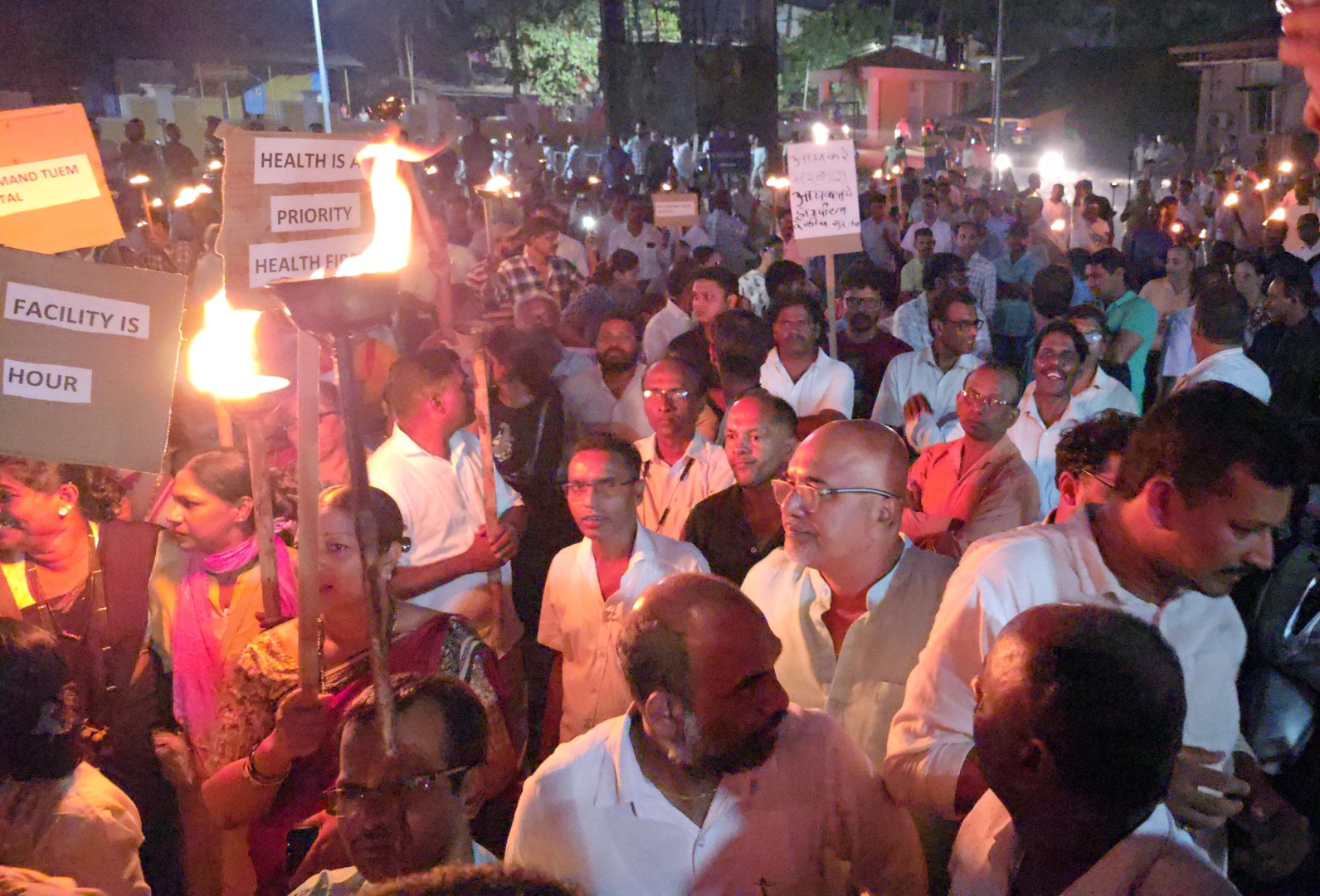 Protesters stage torch rally demanding link hospital status